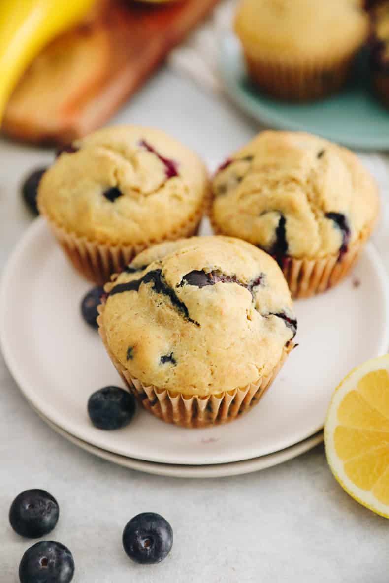3 Lemon blueberry muffins on a small plate.