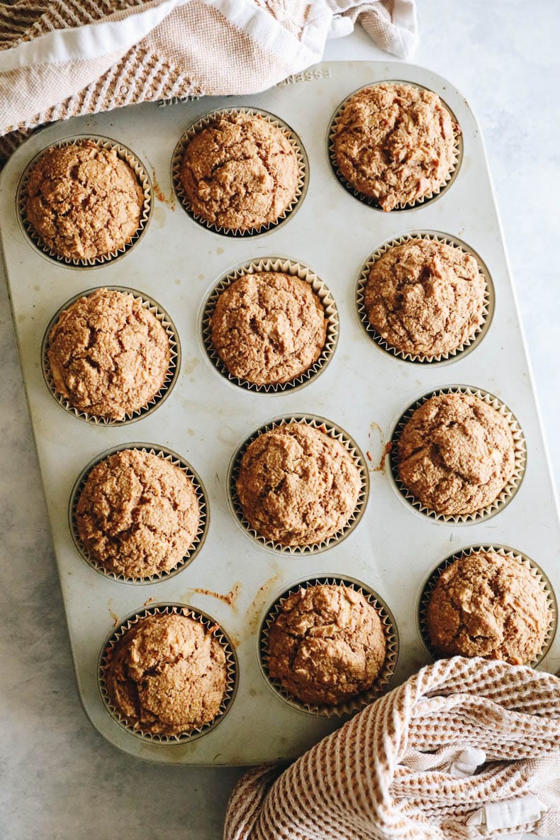 Baked oatmeal apple muffins in a muffin tin.
