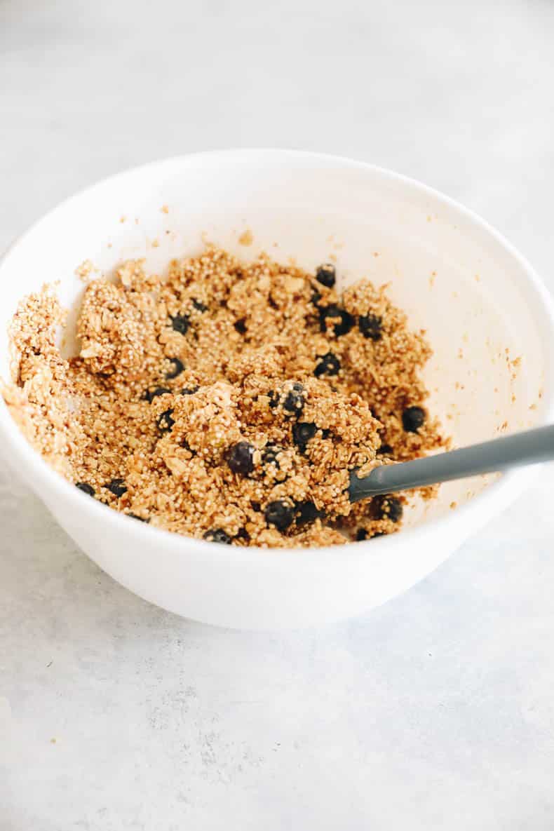 Blueberry quinoa bar batter in a white mixing bowl.