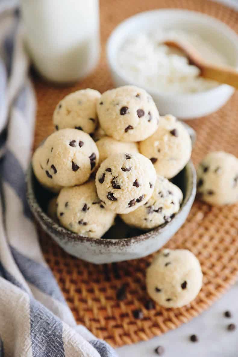 Cottage cheese protein balls with chocolate chips in a blue cup.