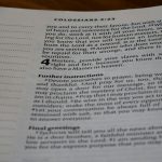 A close up of an open book on a table